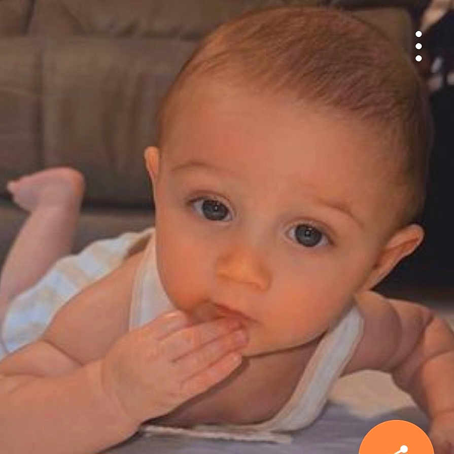 Leo Christopher joined the competition — help win amazing prizes! baby, infant, child, face, hand, eyes, skin, mouth, lying_down, curious, indoor, closeup, person, young, expression, cute, tank_top, head, fingers, floor