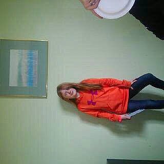 Kaytlynn is registered to the contest to win money with this photo: balloon, ceiling, comfort, elbow, electric_blue, flooring, fun, hip, human_leg, joint, knee, party_supply, person, plaster, room, sandal, sitting, sportswear, thigh, waist