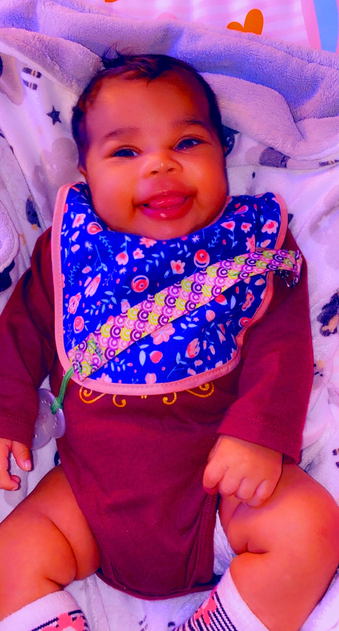 Cyn Niah is registered to the contest to win money with this photo: baby_toddler_clothing, chin, eye, face, finger, happy, head, magenta, mouth, orange, people, person, pink, purple, red, skin, sleeve, smile, textile, toddler
