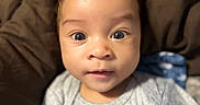 Aero joined the competition — help win amazing prizes! baby, infant, face, eyes, hair, clothing, gray_outfit, cute, portrait, child, young, indoors, soft_background, cozy, curious, expression, skin, person, head, closeup