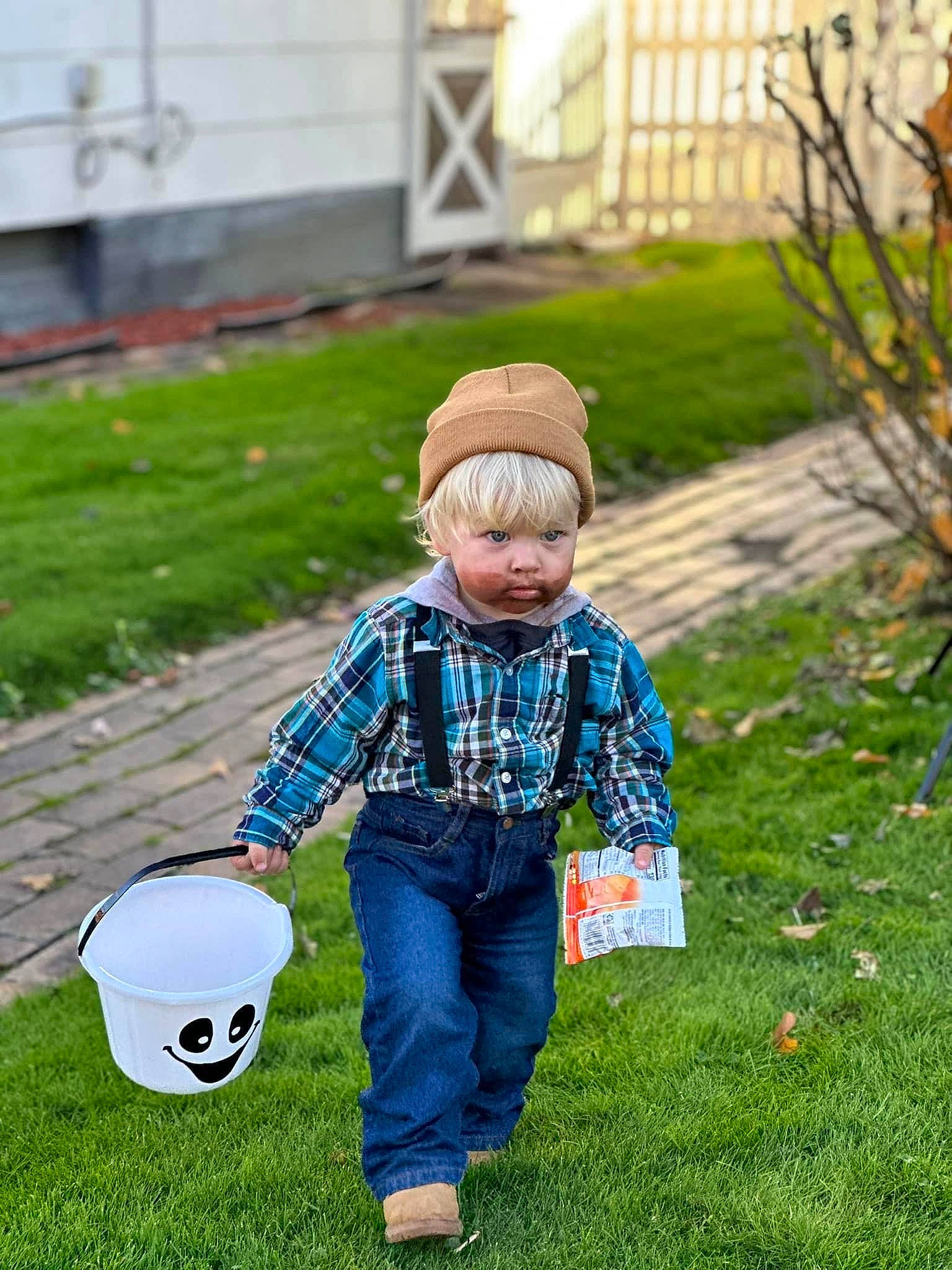 Henry is registered to the contest to win money with this photo: ball, child, electric_blue, flooring, football, fun, grass, headgear, jacket, jeans, lawn, leisure, pattern, people, people_in_nature, person, plaid, plant, sports_equipment, sports_gear