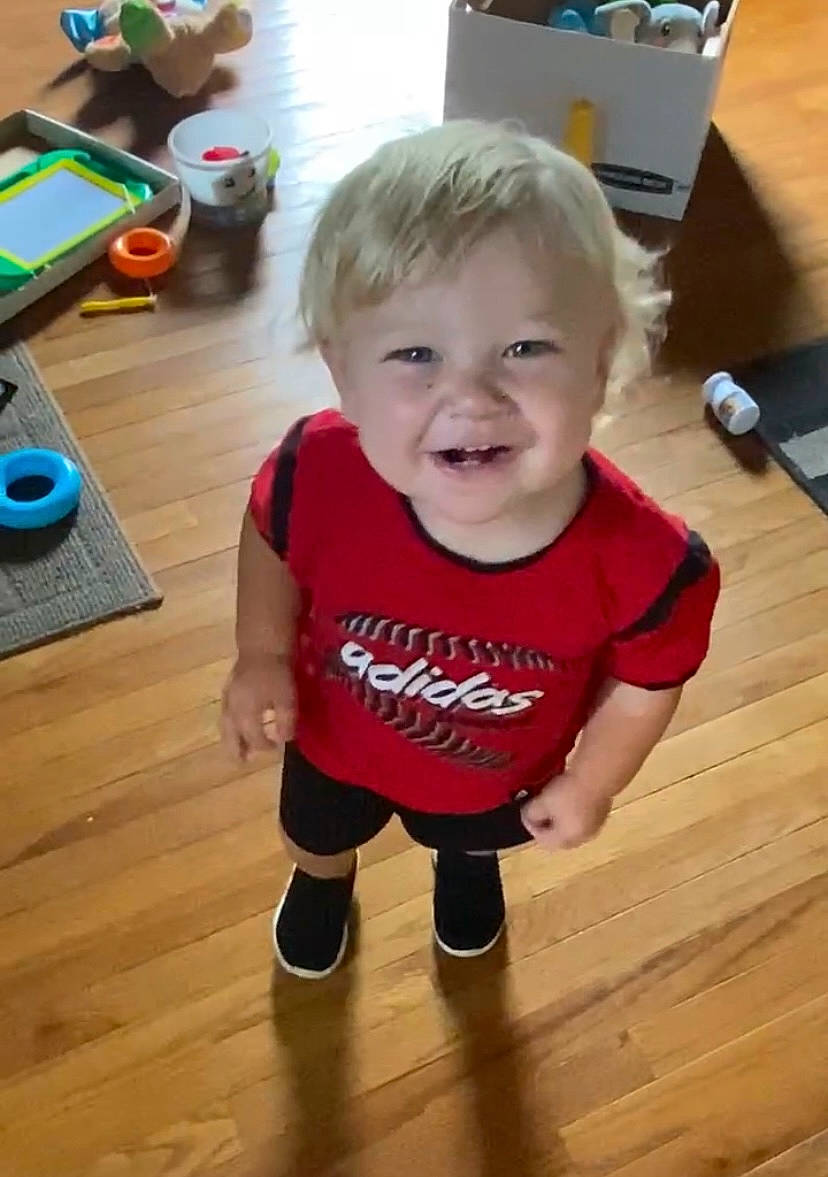 Henry is registered to the contest to win money with this photo: baby, baby_toddler_clothing, cheek, child, floor, flooring, fun, happy, hardwood, joy, laminate_flooring, person, room, skin, sleeve, smile, t_shirt, toddler, varnish, wood