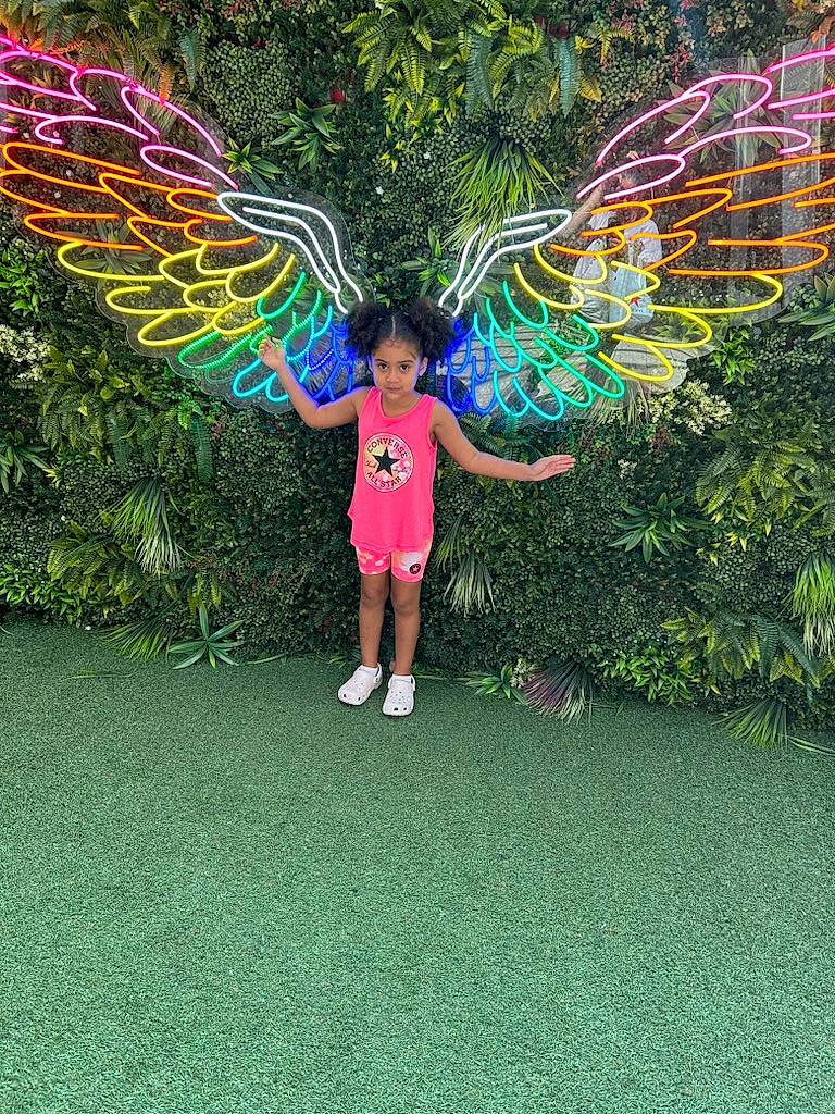 Aaliyah Payton joined the competition — help win amazing prizes! art, automotive_wheel_system, fun, garden, grass, grassland, green, happy, leaf, leisure, magenta, nature, people_in_nature, person, plant, recreation, shorts, symmetry, terrestrial_plant, tree