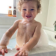 Jayce joined the competition — help win amazing prizes! toddler, child, bathtub, bubbles, foam, bath, curly_hair, smiling, happy, water, skin, window, soap, bubble_beard, hands, bathroom, sink, faucet, light, cute