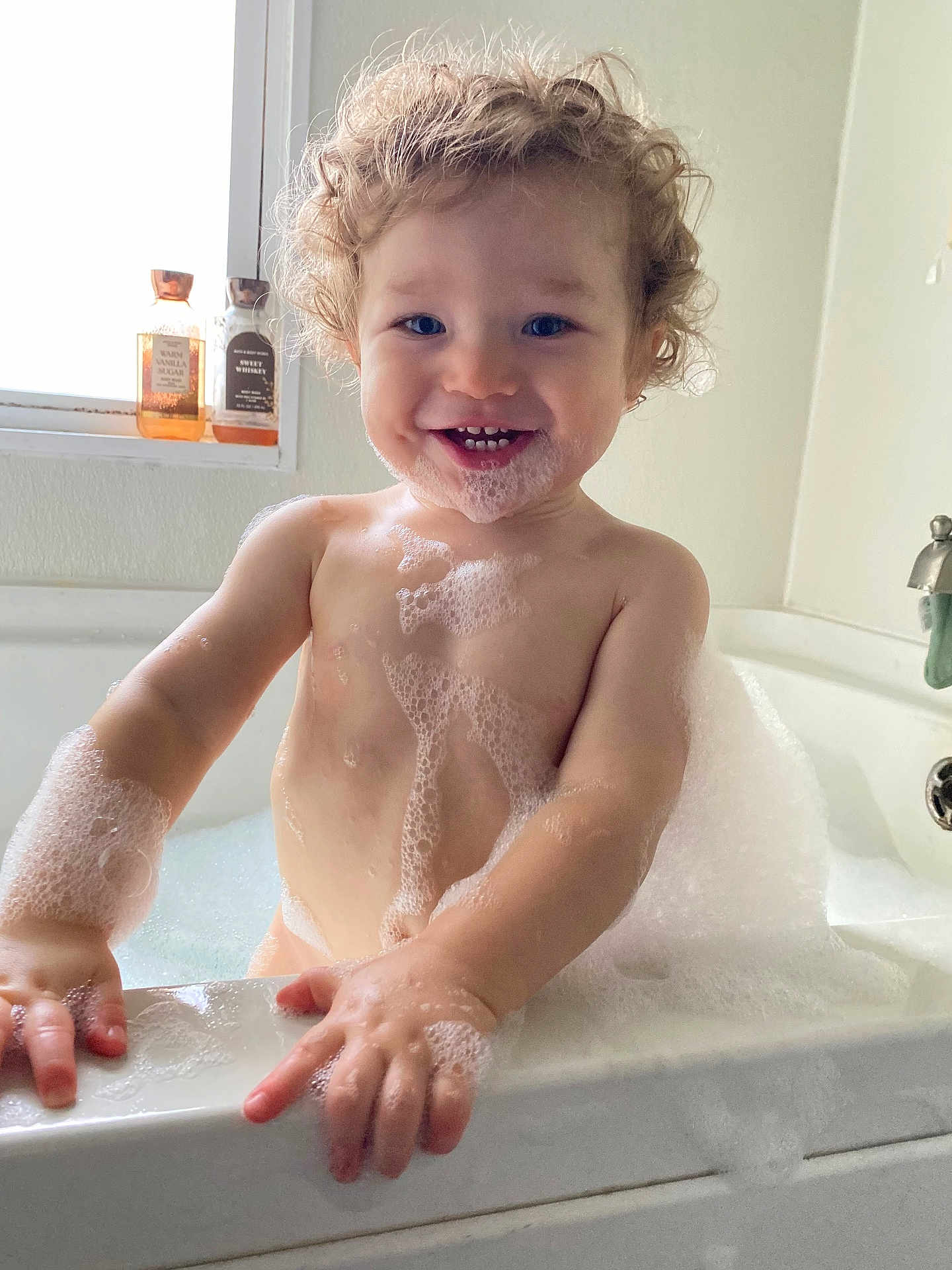 Jayce joined the competition — help win amazing prizes! toddler, child, bathtub, bubbles, foam, bath, curly_hair, smiling, happy, water, skin, window, soap, bubble_beard, hands, bathroom, sink, faucet, light, cute
