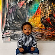 Iyinoluwa is registered to the contest to win money with this photo: baby, child, infant, sitting, barefoot, checkered_shirt, jeans, curly_hair, portrait, indoor, mural, artwork, painting, colorful, birds, expression, face, cute, young, person