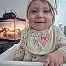 Echo joined the competition — help win amazing prizes! toddler, child, baby, high_chair, bib, hat, smile, face, hand, indoor, terrarrium, plant, wood, furniture, cozy, portrait, clothing, cute, happy, infant