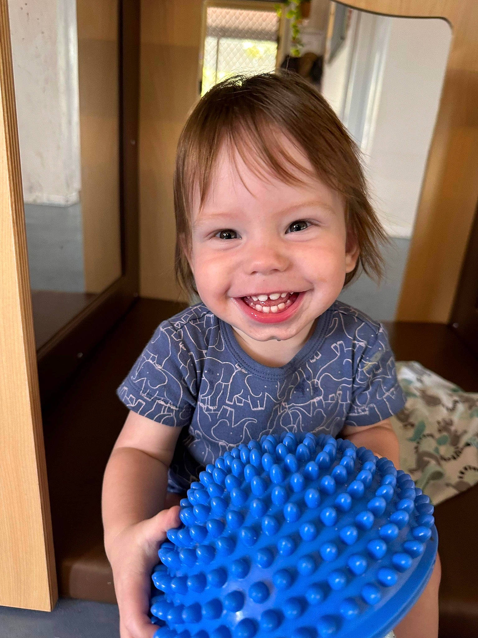 Dakota is registered to the contest to win money with this photo: baby_toddler_clothing, basket, child, electric_blue, eye, finger, fun, happy, head, iris, joy, pattern, person, play, room, shoulder, sitting, sleeve, smile, standing