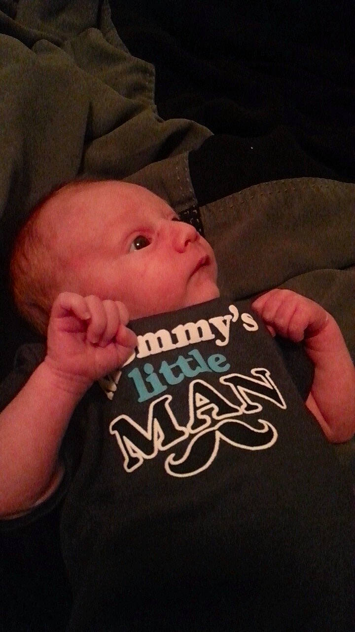 Cole is registered to the contest to win money with this photo: arm, cheek, child, cool, ear, facial_hair, finger, forehead, fun, hand, head, human, infant, mouth, neck, person, product, smile, toddler