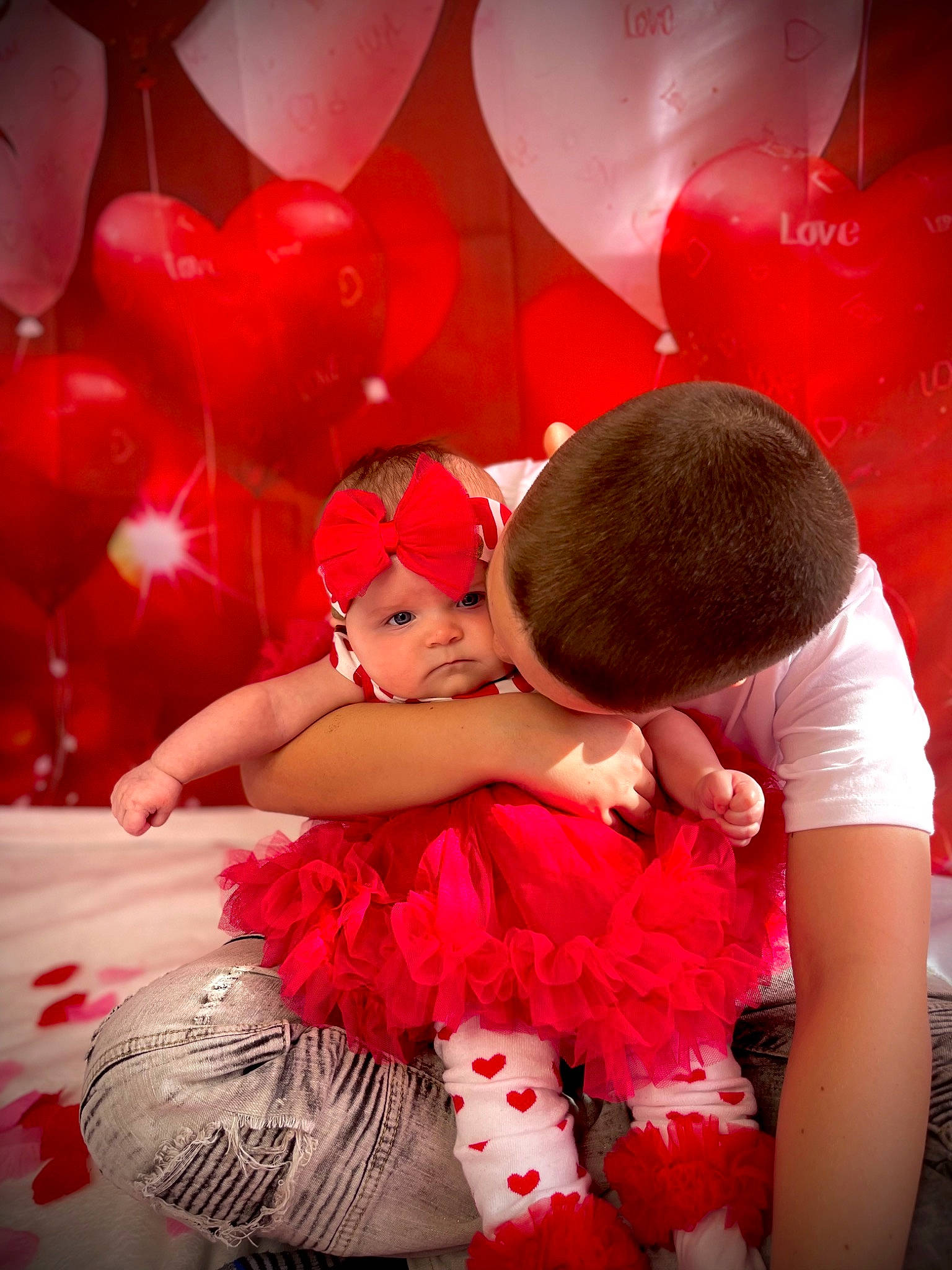 Arianna is registered to the contest to win money with this photo: baby, beauty, child, entertainment, event, flash_photography, fun, gesture, happy, headpiece, headwear, interaction, leisure, love, magenta, performing_arts, person, petal, pink, red