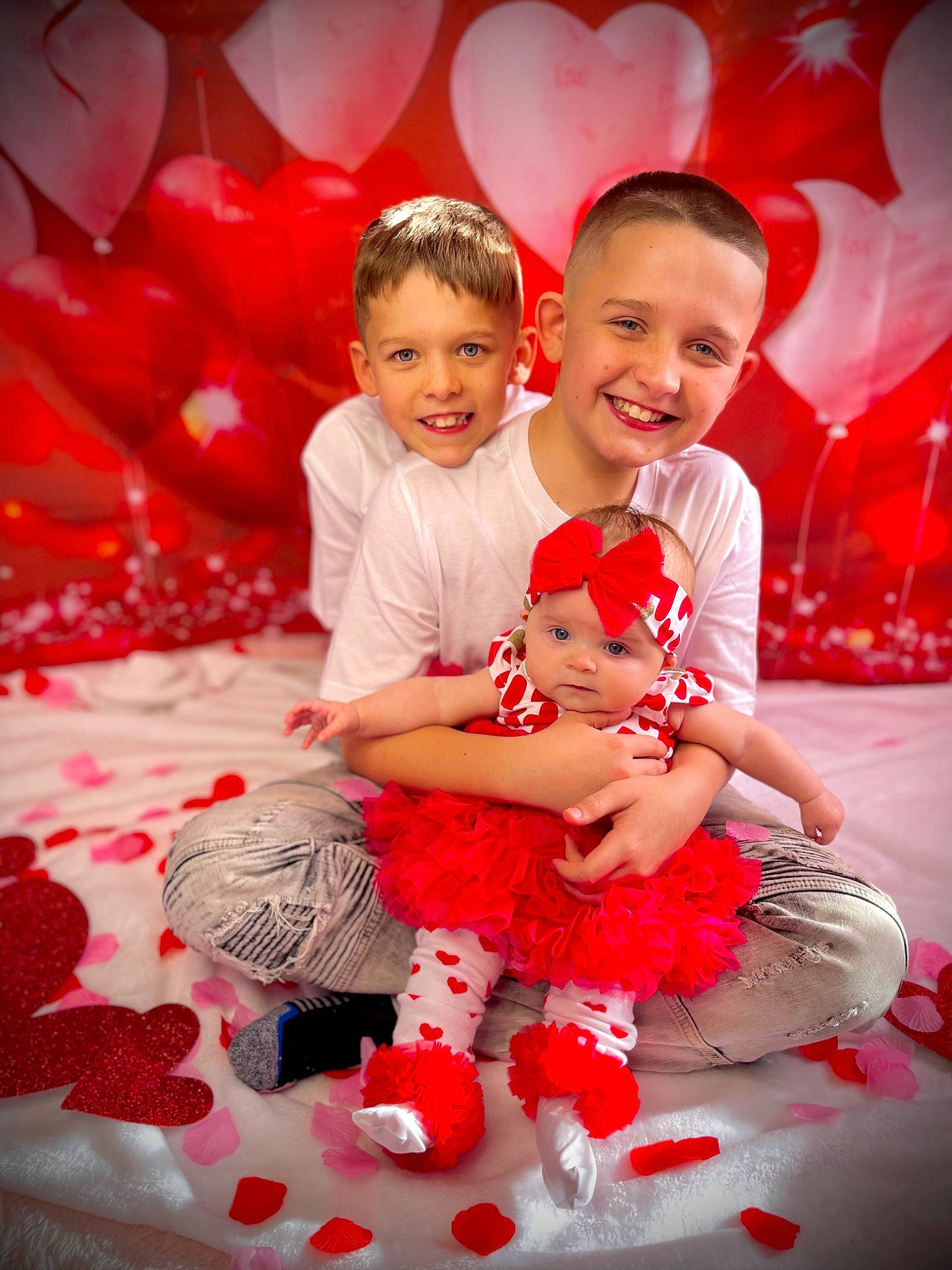 Arianna is registered to the contest to win money with this photo: baby, baby_toddler_clothing, child, event, flash_photography, flooring, fun, happy, headwear, holiday, joy, leisure, linens, magenta, pattern, person, petal, pink, red, sitting