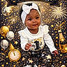 baby, child, celebration, new_year, first_birthday, party, fireworks, balloons, clock, champagne_bottle, sparkles, stars, headband, white_bow, festive_clothing, sitting, smiling, holiday, cute, portrait