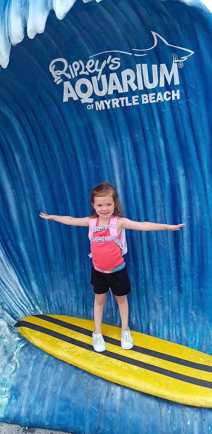 Keelie joined the competition — help win amazing prizes! advertising, azure, child, electric_blue, event, fun, happy, human_body, human_leg, joy, knee, leisure, magenta, person, recreation, sandal, shorts, smile, stage_equipment, t_shirt