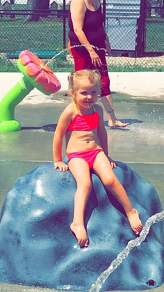 Kylie is registered to the contest to win money with this photo: barefoot, child, foot, fun, games, happy, human_leg, joy, leg, leisure, one_piece_swimsuit, people, people_on_beach, person, pink, play, recreation, smile, summer, swimwear