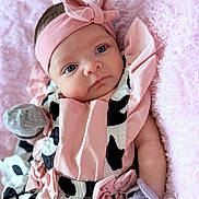 Gianna joined the competition — help win amazing prizes! baby, infant, headband, pink, blue_eyes, blanket, soft_texture, clothing, cute, portrait, newborn, child, lying_down, indoor, closeup, ribbon, gloves, fashion, person, adorable