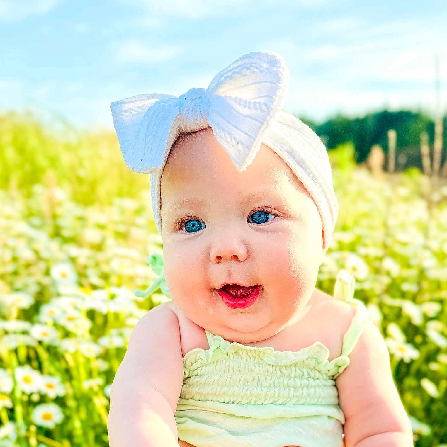 Kinsley joined the competition — help win amazing prizes! baby, babylaughing, clothing, daisy, dress, face, flower, grass, happy, hat, head, laughing, nature, outdoors, person, petal, photography, plant, portrait, smile