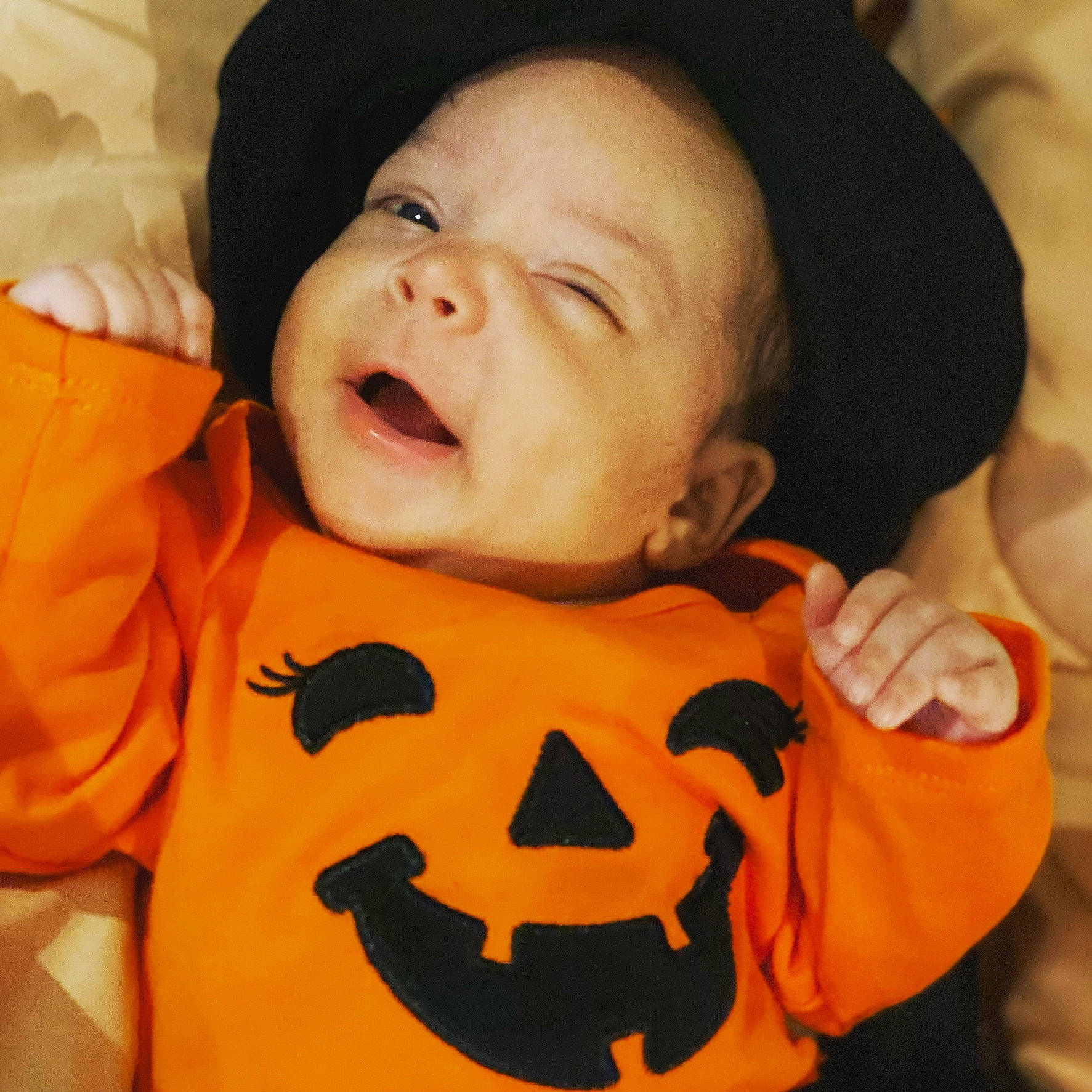 Queendior is registered to the contest to win money with this photo: baby, calabaza, cheek, child, face, facial_expression, happy, head, laugh, mouth, person, pumpkin, smile, toddler, trick_or_treat, yawn