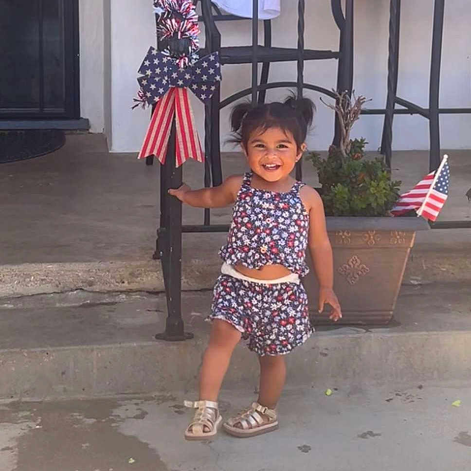 Catalina joined the competition — help win amazing prizes! americanflag, city, clothing, face, flag, footwear, head, jar, person, photography, plant, planter, portrait, pottedplant, pottery, road, sandal, shorts, street, urban