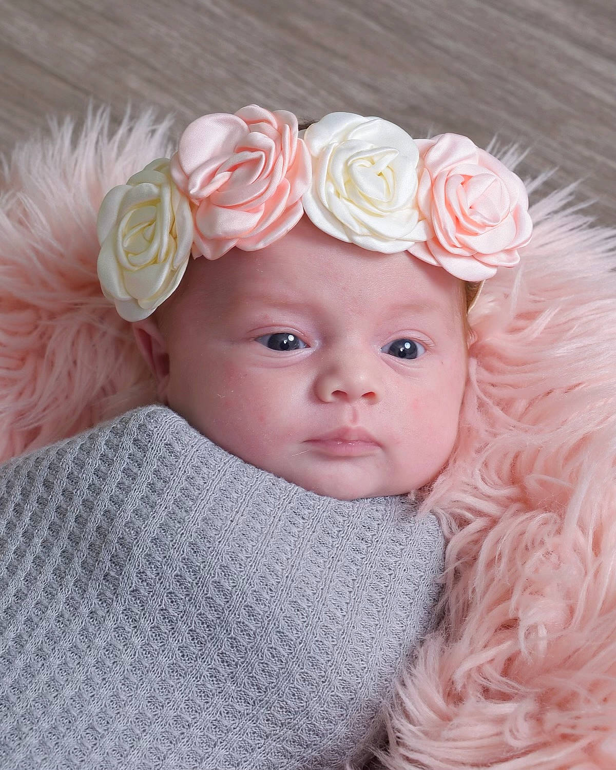 Sophia is registered to the contest to win money with this photo: baby, baby_toddler_clothing, cheek, chin, embellishment, eyebrow, face, flower, hat, head, headgear, headpiece, headwear, iris, lip, person, petal, pink, skin, sleeve