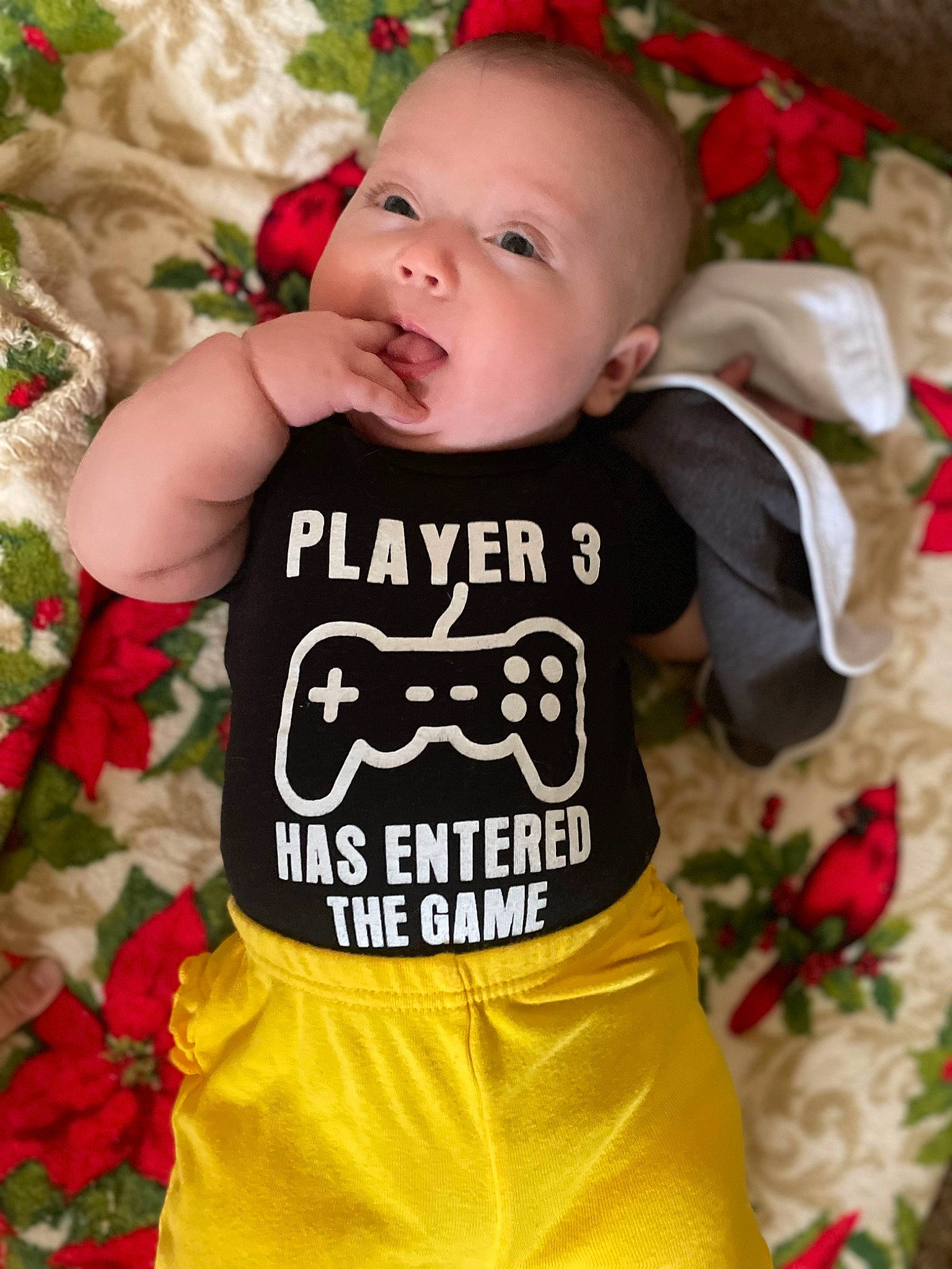 Ellen is registered to the contest to win money with this photo: baby, baby_toddler_clothing, cheek, child, face, green, happy, head, orange, pattern, people, person, pink, product, red, sleeve, t_shirt, textile, toddler, white