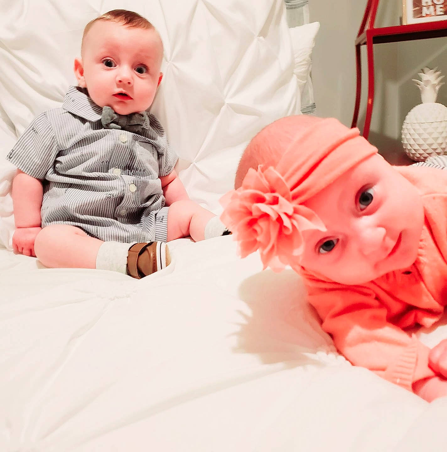 Athena is registered to the contest to win money with this photo: baby, baby_sleeping, cheek, child, ear, head, headwear, outerwear, person, photography, pink, product, room, skin, sleeve, surprise, toddler