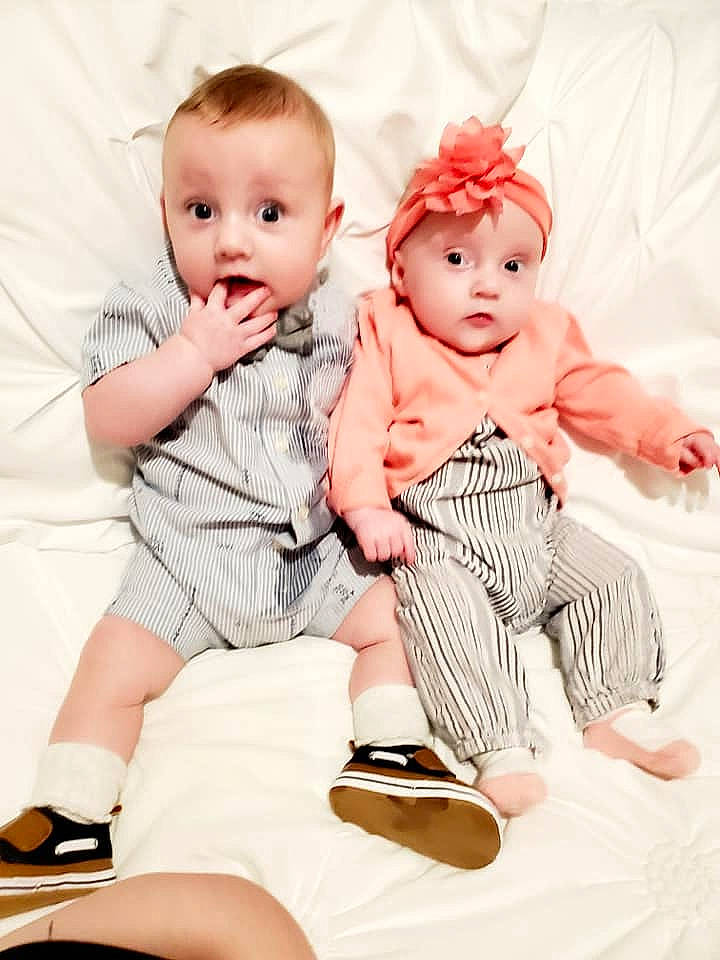 Athena is registered to the contest to win money with this photo: baby, baby_products, baby_toddler_clothing, cheek, child, child_model, family, happy, headwear, leg, people, person, photograph, photography, pink, product, sibling, sitting, skin, sleeve