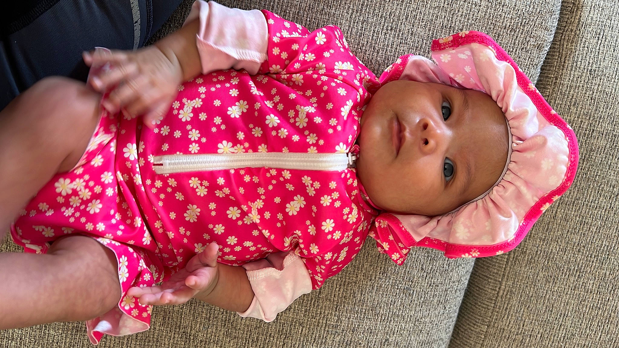 Emilia joined the competition — help win amazing prizes! baby, baby_toddler_clothing, cheek, child, comfort, finger, fun, happy, headwear, human_leg, lap, magenta, nail, pattern, person, pink, red, sitting, skin, sleeve