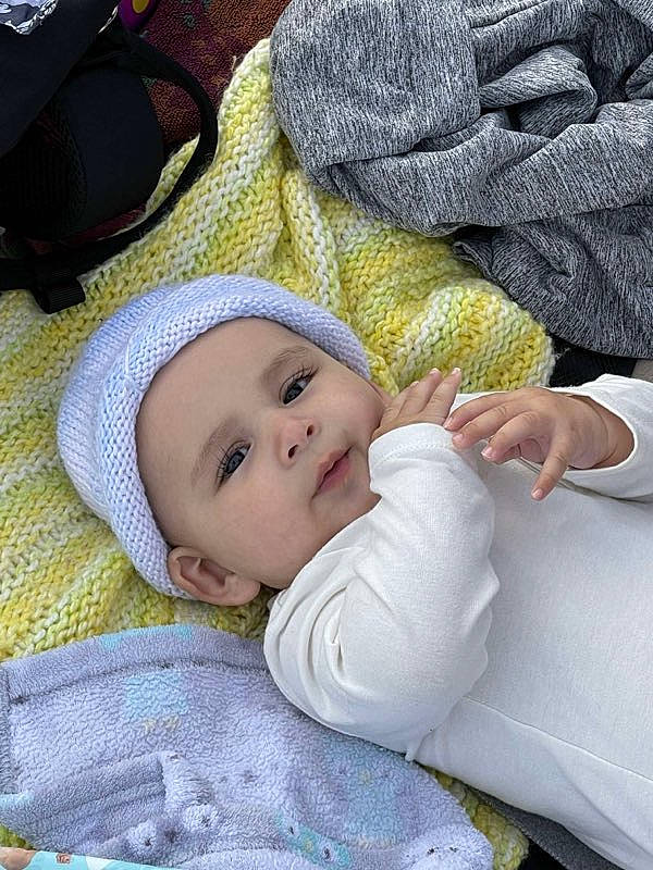 Beaux joined the competition — help win amazing prizes! baby, baby_products, baby_toddler_clothing, cap, cheek, child, comfort, eye, gesture, grass, happy, head, headwear, linens, nose, person, sitting, skin, sleeve, smile