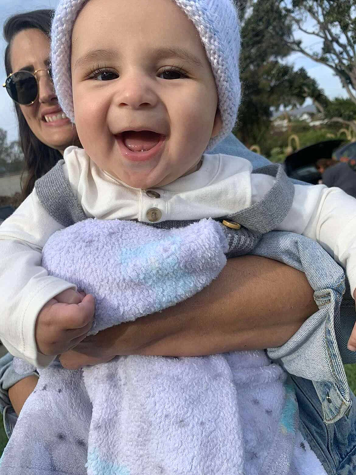 Beaux joined the competition — help win amazing prizes! baby, baby_toddler_clothing, cap, child, fashion_accessory, fun, gesture, grass, happy, joy, laugh, lip, outerwear, person, pink, recreation, sitting, skin, sleeve, smile