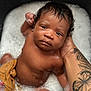 Jaikhyius is registered to the contest to win money with this photo: baby, infant, bath, bubbles, water, tattoo, arm, butterfly_tattoo, flower_tattoo, skin, wet, newborn, person, child, hand, soapy, relaxing, portrait, cute, care