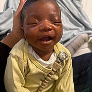 Jaikhyius is registered to the contest to win money with this photo: baby, smiling, closed_eyes, yellow_clothing, pacifier_clip, hand, blanket, soft_texture, infant, happy, indoors, sleepy, cute, portrait, child, newborn, comfort, resting, toddler, skin