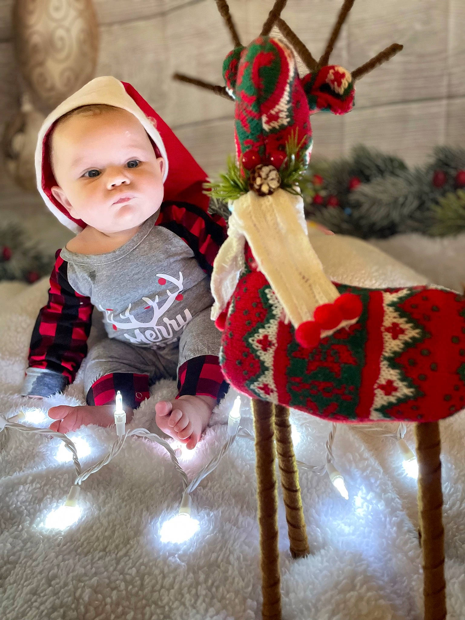 Theo joined the competition — help win amazing prizes! baby, baby_toddler_clothing, carmine, christmas, christmas_decoration, christmas_eve, christmas_ornament, costume_hat, event, fawn, fictional_character, happy, holiday, holiday_ornament, ornament, pattern, person, plant, red, toddler