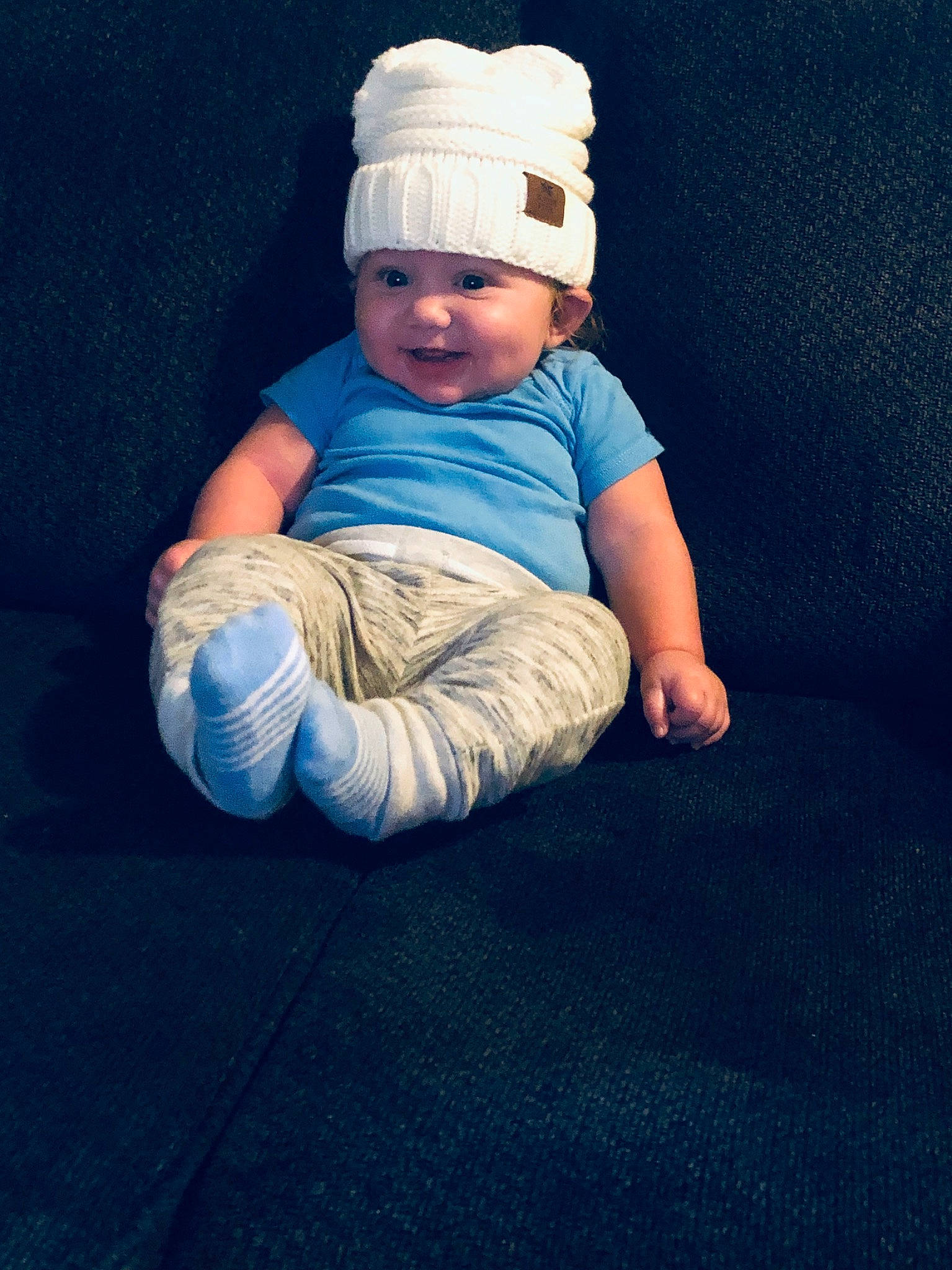 Malikai joined the competition — help win amazing prizes! baby, baby_sleeping, beanie, blue, child, hand, headgear, headwear, person, photography, sitting, smile, toddler