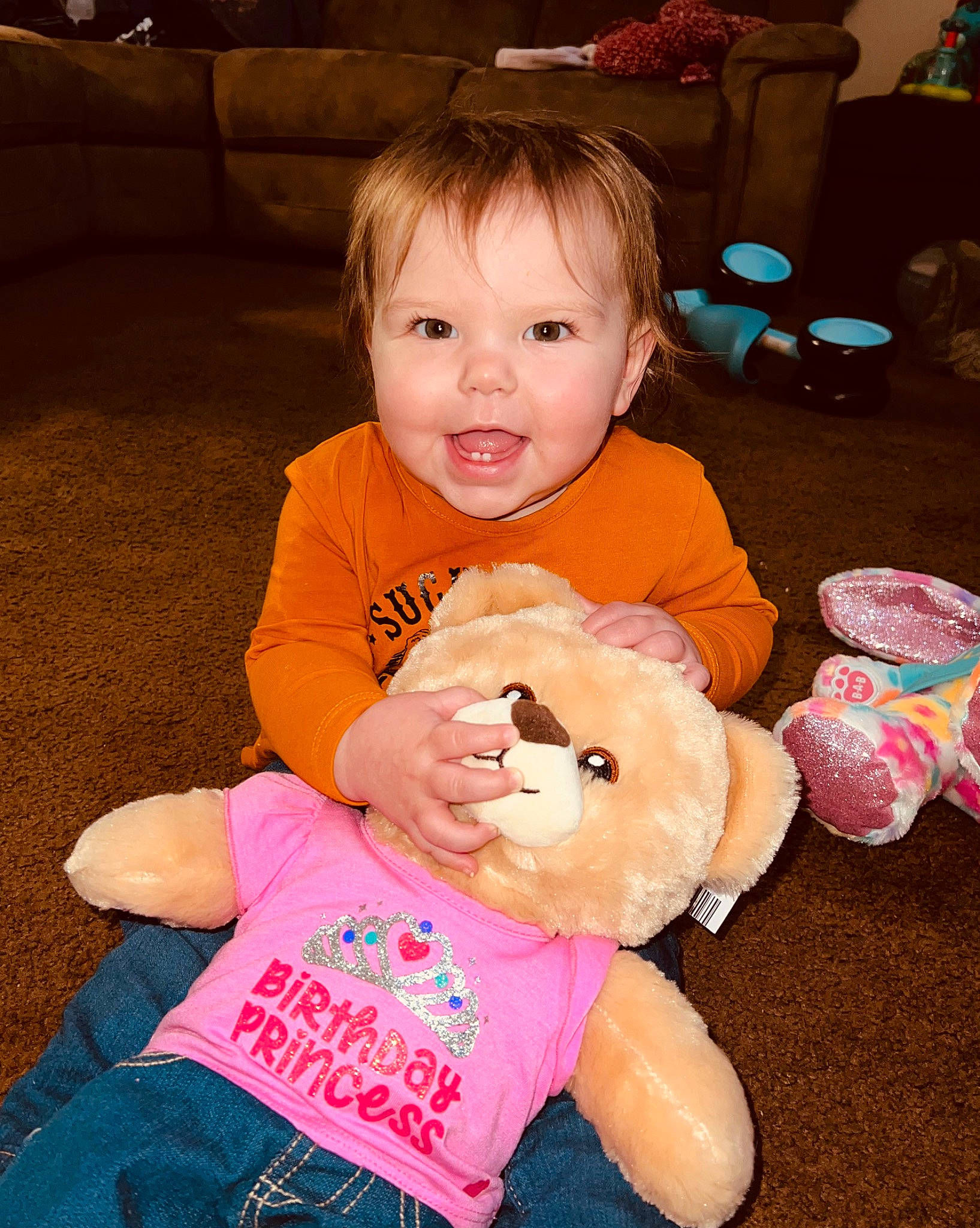 Oaklee joined the competition — help win amazing prizes! baby, baby_toddler_clothing, cheek, child, couch, finger, fun, hair, happy, lap, nose, person, pink, play, sitting, skin, smile, stuffed_toy, teddy_bear, toddler