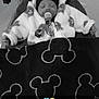 Myllan participe au concours pour gagner de l'argent avec cette photo : baby, bed, blanket, blanket_pattern, child, clothing, cozy, cute, face, hat, hooded_jacket, indoor, infant, mickey_mouse, monochrome, pacifier, person, resting, sleeping, toddler