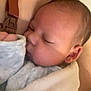 Myllan participe au concours pour gagner de l'argent avec cette photo : baby, blanket, closeup, clothing, comfort, cuddle, ear, face, hand, indoor, infant, newborn, peaceful, person, portrait, skin, sleeping, soft, tender, warm