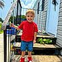 architecture, boy, building, child, clothing, face, footwear, handrail, head, house, jeans, male, pants, person, photography, portrait, railing, shoe, shorts, sneaker
