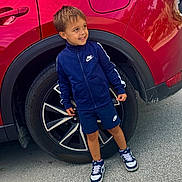 Preston joined the competition — help win amazing prizes! asphalt, boy, car, casual, child, daytime, fashion, happy, jacket, nike, outdoor, portrait, red, shorts, smiling, sneakers, sportswear, standing, tire, young
