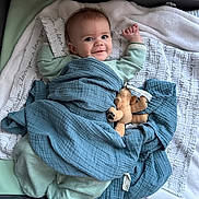 Jaxon joined the competition — help win amazing prizes! baby, bed, bedroom, blanket, clothing, crib, cushion, face, furniture, happy, head, homedecor, infantbed, newborn, pants, person, photography, portrait, quilt, smile