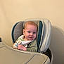 Landon Charles joined the competition — help win amazing prizes! baby, high_chair, bib, infant, child, smile, face, indoor, furniture, clothing, seat, person, young_child, cute, looking, table, skin, head, expression, comfortable