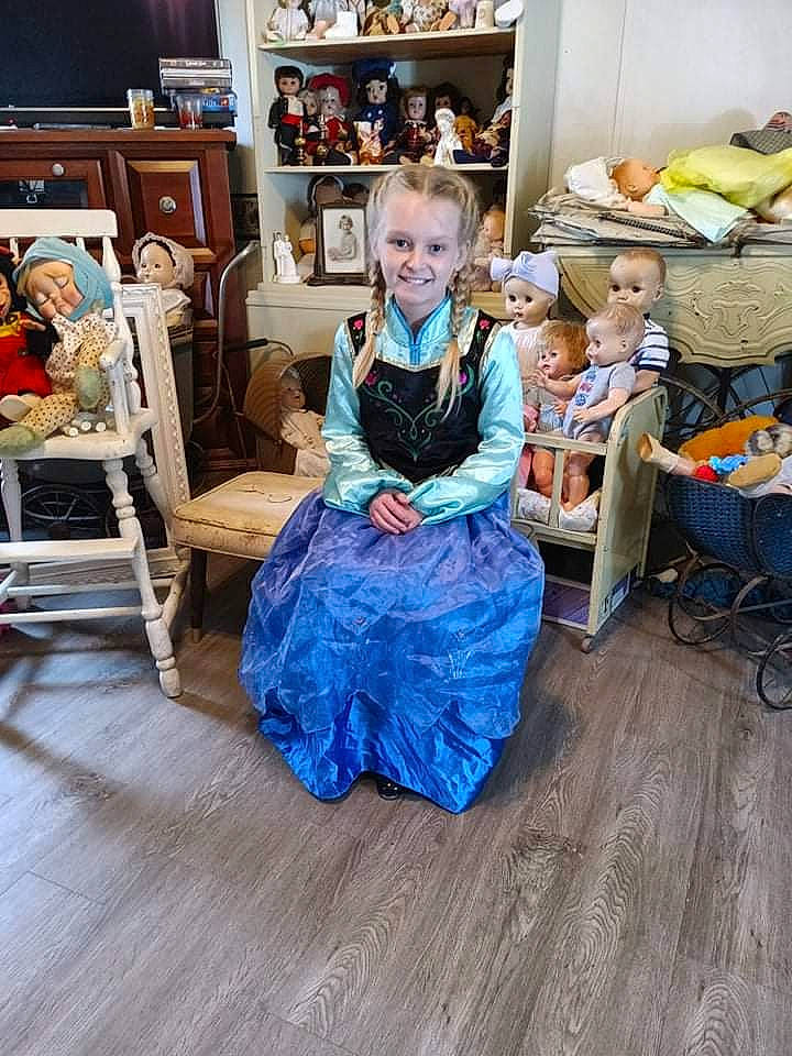 Ashlynn is registered to the contest to win money with this photo: azure, blurred, chest_of_drawers, drawer, dress, event, fashion_design, floor, flooring, happy, hardwood, house, joy, laminate_flooring, person, picture_frame, shelf, shelving, sitting, smile