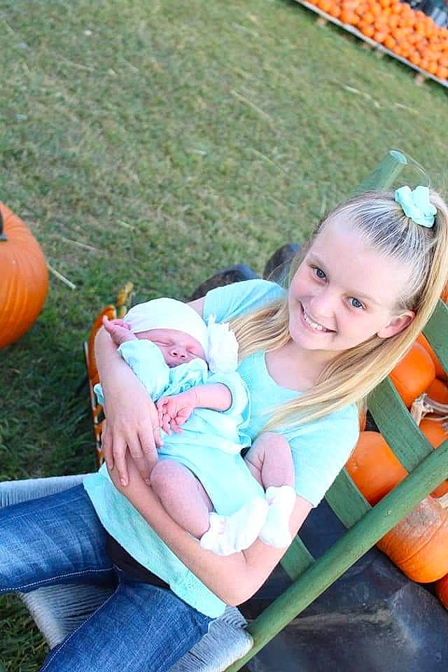 Ashlynn joined the competition — help win amazing prizes! baby, baby_products, baby_toddler_clothing, child, comfort, event, fun, grass, happy, joy, lap, lawn, leisure, people_in_nature, person, plant, recreation, sitting, smile, summer