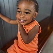 Jahkyle joined the competition — help win amazing prizes! child, toddler, smile, orange_clothing, bench, happy, portrait, indoors, face, cute, person, short_hair, skin, young, sitting, joyful, expression, bright, background, casual
