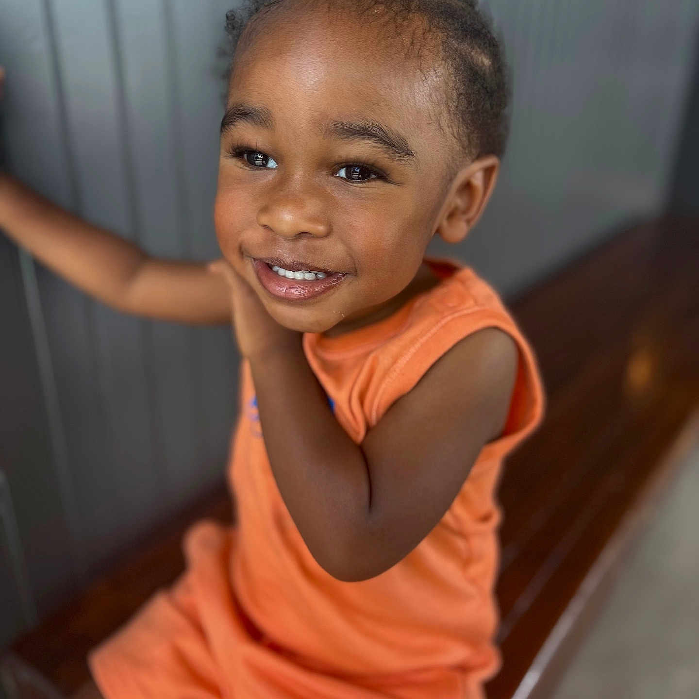 Jahkyle joined the competition — help win amazing prizes! child, toddler, smile, orange_clothing, bench, happy, portrait, indoors, face, cute, person, short_hair, skin, young, sitting, joyful, expression, bright, background, casual