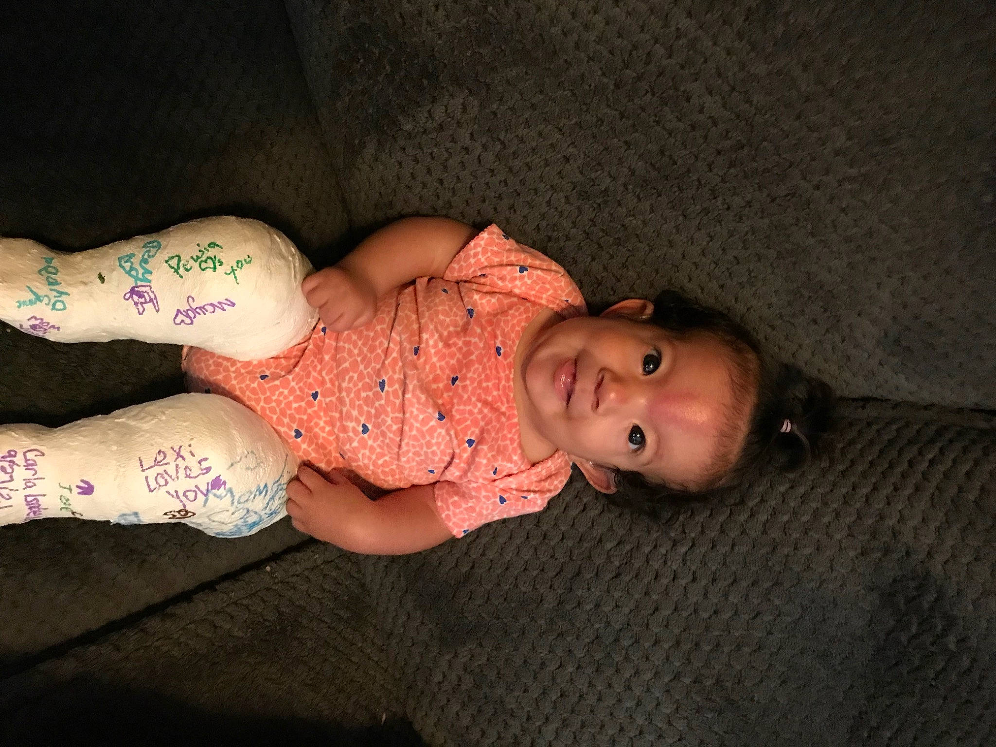 Carla is registered to the contest to win money with this photo: abdomen, baby_toddler_clothing, chest, comfort, elbow, finger, hair, hand, headgear, human_body, human_leg, knee, leg, neck, person, skin, sleeve, thigh, trunk, waist