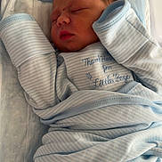Micah joined the competition — help win amazing prizes! newborn, baby, infant, sleeping, blanket, blue, crib, bed, clothing, portrait, cute, wrapped, soft, peaceful, indoors, person, child, resting, toddler, face