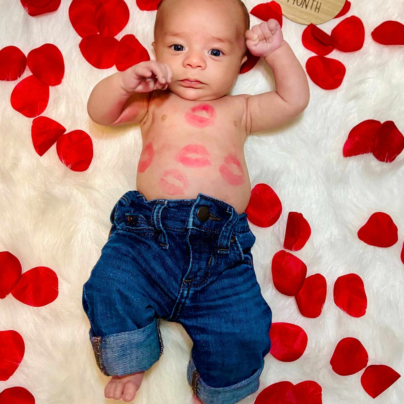 Ramon is registered to the contest to win money with this photo: baby, bodypart, clothing, face, finger, flower, hand, happy, head, jeans, leaf, pants, person, petal, photography, plant, portrait, shorts, smile, symbol
