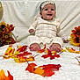 baby, child, smiling, knitwear, headband, autumn, fall_leaves, flowers, pumpkin, decorations, indoors, white_blanket, cute, celebration, portrait, sitting, happy, seasonal, festive, colorful