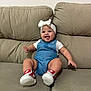Isabella joined the competition — help win amazing prizes! baby, beige, bow, child, couch, cute, denim, footwear, happy, headband, indoor, infant, nike, overalls, person, portrait, sitting, smiling, white_shirt, young_child