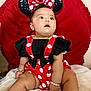 accessories, baby, black, blanket, bracelet, child, costume, cute, earrings, footwear, headband, indoors, infant, mickey_mouse, minnie_mouse, polka_dot, portrait, red, sitting, white